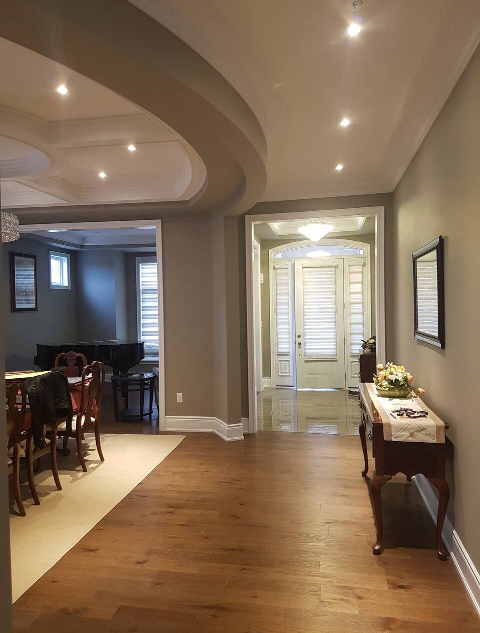 Recessed pot lights installed in a Toronto hallway