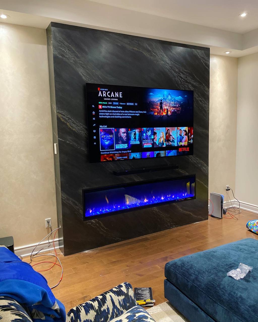 TV wall and fireplace after lighting installation