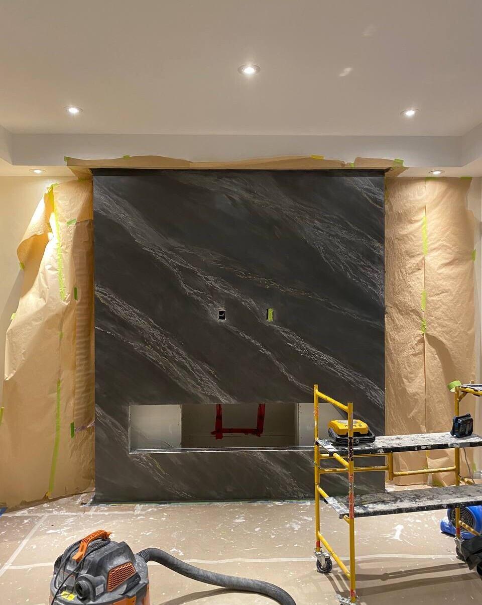 TV wall and fireplace before lighting installation